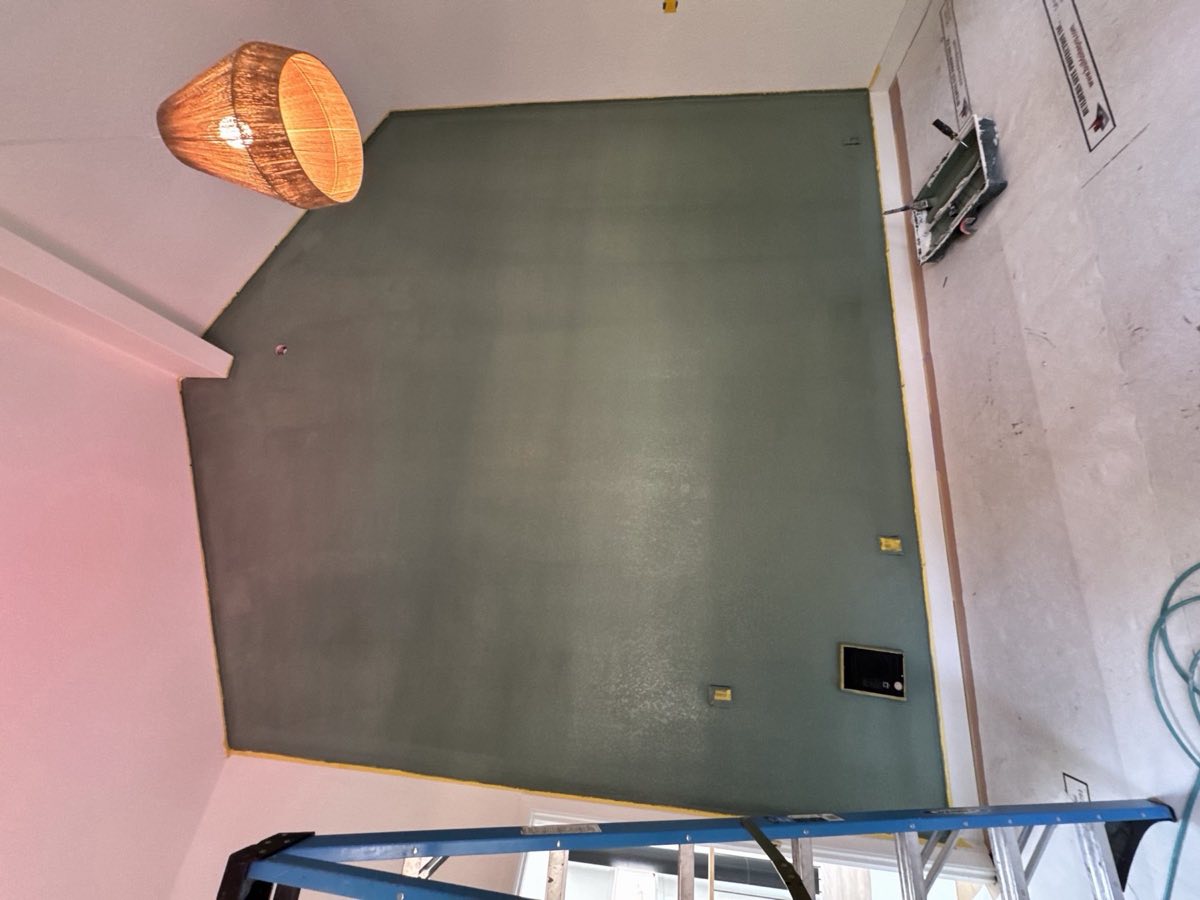 Rolling a fresh sage green accent wall