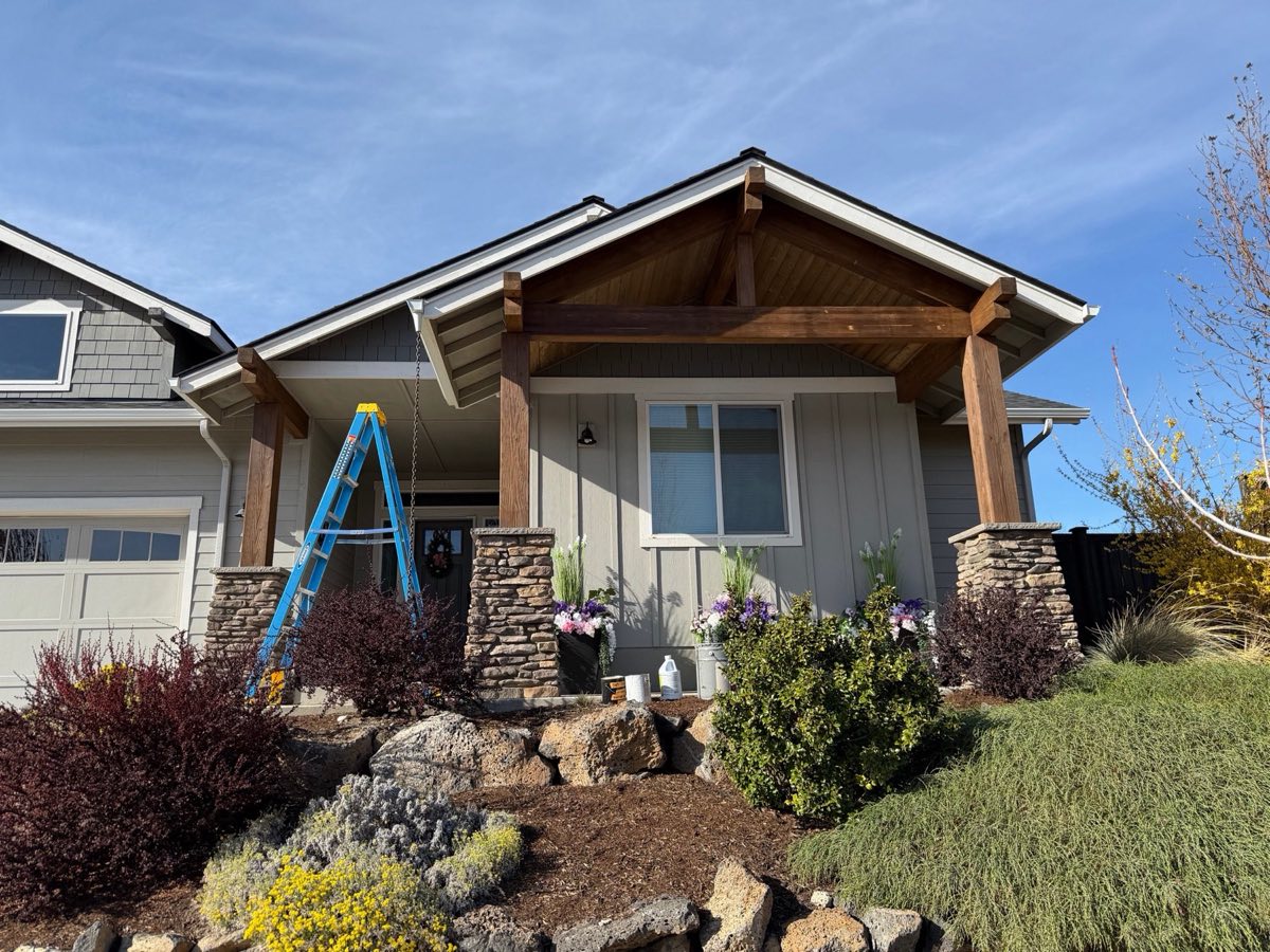 Craftsman front beams and outriggers restored with a chemical wash and wood brightener, sanded, and restained by Keystone Painting LLC in Bend, Oregon