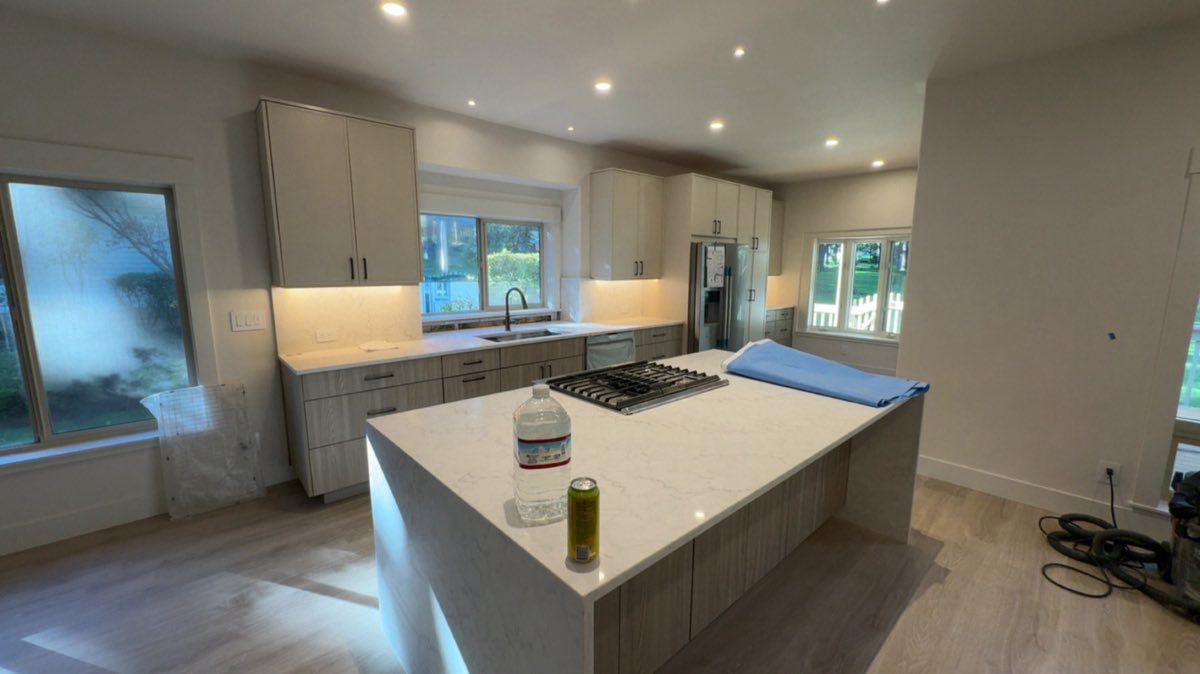 Kitchen in a gutted Mountain High remodel repainted in one color and three sheens, flat ceilings, matte walls and satin trim, by Keystone Painting LLC in Bend, Oregon