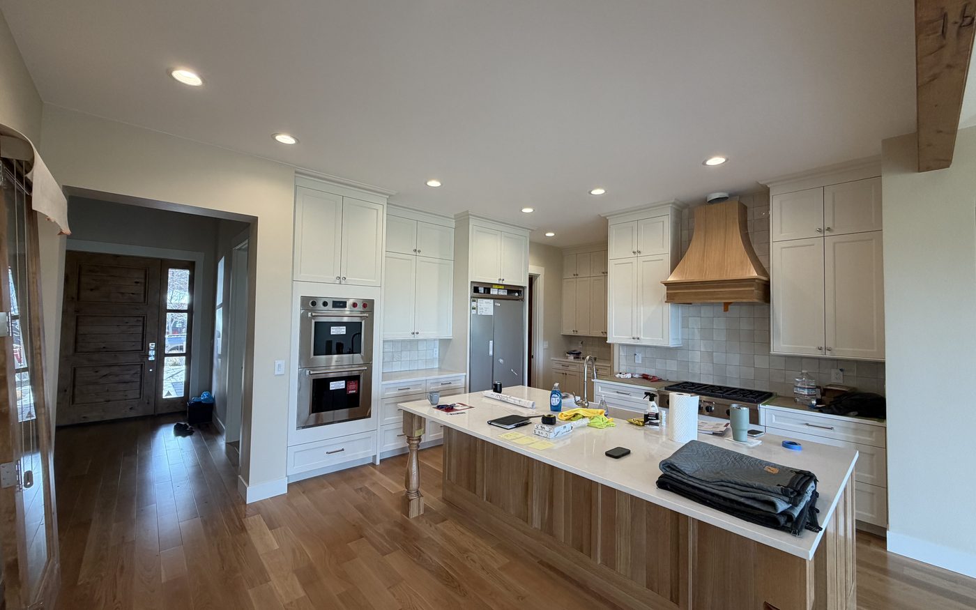 Kitchen and great room in a full-scale Tetherow remodel, walls and millwork painted in a three-color, three-sheen scheme by Keystone Painting LLC in Bend, Oregon